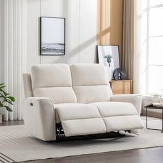 a white reclining sofa in a living room