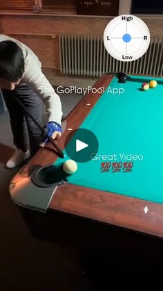 a young boy is playing pool on the table