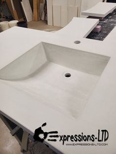 a white sink sitting on top of a counter