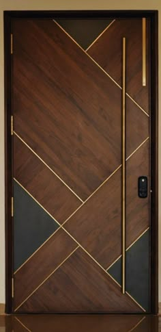 a wooden door with gold trim and geometric design