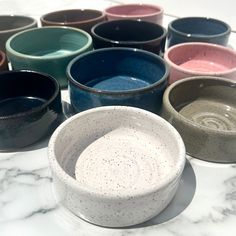 Show your sweet fur-baby some love with these colorful ceramic food/water dishes! *HANDMADE ITEMS ARE UNIQUE AND THEREFORE NO TWO DISHES WILL BE IDENTICAL* Approximate dimensions: *1 Cup: 4.25" diameter, 1.25" height *2 Cup: 4.75" diameter, 1.75" height *If you feed your pet exactly 1 cup of food, I suggest ordering the 2 cup size to allow for some extra space. The 1 cup size easily fits a can of cat food. If you need a bigger size, please click on my shop to see the other listings. (We use the 1 cup size for our rabbits and kittens, and 2 cup for our adult cats) COLORS: *Midnight black sometimes shows some blue where the glaze is thicker, usually on the inside of the dish and the speckles almost appear as stars *Gray is a slightly warm gray *Sunset is mostly red, with oranges and purples Handmade Bowls Pottery, Cats Colors, Ceramic Cat Bowl, Ceramic Food, Cat Water Bowl, Ceramic Projects, Pottery Inspo, Bowl Pottery, Cat Rabbit