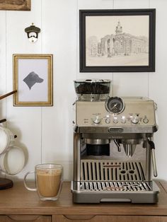 a coffee machine sitting on top of a wooden table