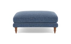 a blue footstool with wooden legs on an isolated white background, side view