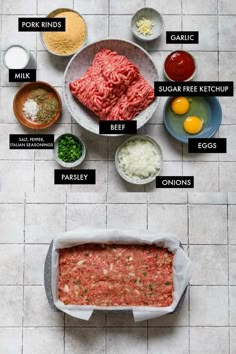 the ingredients for meatloaf laid out in bowls on a tile floor with labels