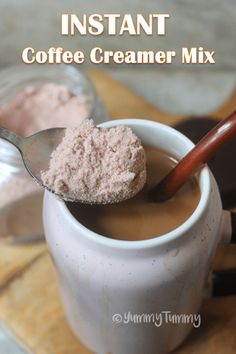 a spoon full of coffee creamer mix in a cup with the words instant coffee creamer mix on it