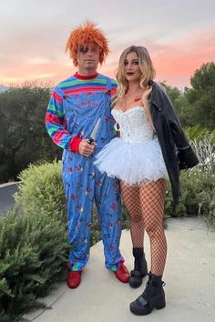 two people in costumes standing next to each other