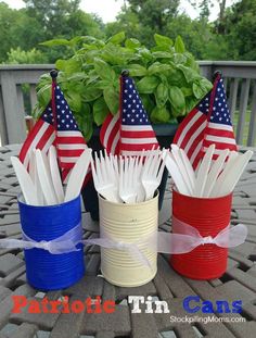 patriotic straw cups with toothpicks in them on a patio table next to a potted plant