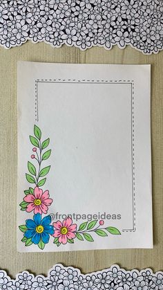 a paper with flowers and leaves on it next to doily trimming around the edges