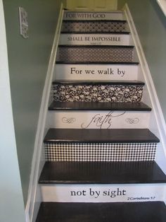 the stairs are painted with black and white designs, but they have words on them