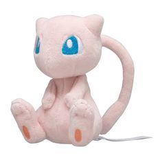 a pink stuffed animal with blue eyes sitting on top of a white floor next to a cord