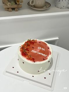 a cake sitting on top of a white table