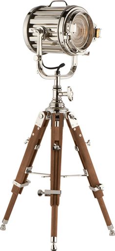 an old fashioned telescope on a tripod with wooden legs and metal parts, isolated against a white background