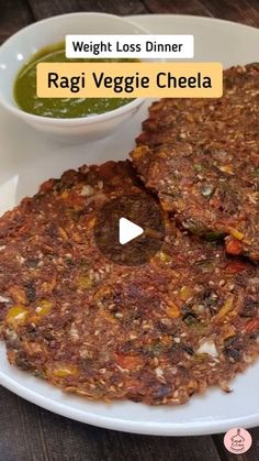 two veggie cakes on a white plate next to a bowl of soup