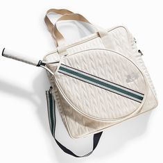 "This Tennis bag is made of the softest most luxurious vegan leather you have ever felt. In addition to the million dollar look we believe in design of safe-to-use products and material quality.  The material used is REACH compliant. REACH, which stands for Registration, Evaluation, Authorization, Restriction of Chemicals, aims to better protect health and the environment. Crafted with quilted, water and tear-resistant fabrics, these tennis bags protect your rackets and gear. Separate compartments accommodate your racket, while slip pockets and dedicated internal pockets keep your wallet, phone, water bottle, and ball can organized. Complimentary Shoe Bag and Versatile Carrying Options: Each Tennis bag includes a matching shoe bag, ensuring your footwear stays protected and organized along Pickleball Bag, Tennis Bags, Tennis Bag, Smells Good, Phone Water, Pickleball Gift, Sports Bags Gym, Million Dollar, Pickleball