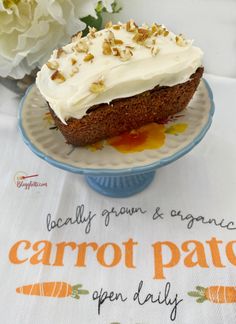 a carrot cake sitting on top of a blue plate