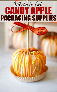 there is a candy apple with orange swirls on it and the words, where to get candy apple packaging supplies