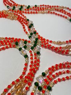 "Oupoyo" – a Single Strand Waist Bead that brings together the rich warmth of orange crystal glass seed beads, the captivating allure of emerald green crystal glass seed bead accents, and the subtle opulence of gold glass seed bead accents. ✨ Vibrant Orange Radiance: Oupoyo exudes a radiant glow with its vibrant orange crystal glass seed beads, reflecting the energy of the sun and infusing your ensemble with a lively and spirited charm. 🌿 Emerald Green Elegance: Accentuating the design are emer Emerald Green Crystal, Strong Hand, Orange Crystals, Green Crystal, Gold Glass, Glass Seed Beads, Green Crystals, Vibrant Orange, Deep Green