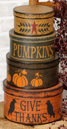 a stack of pumpkins painted on top of each other with the words give thanks