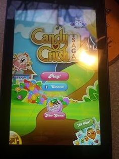 the game candy crush is displayed on an iphone