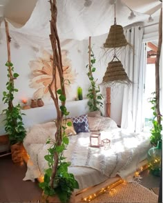 a bed with plants and lights on it