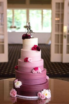 a multi layer cake sitting on top of a table