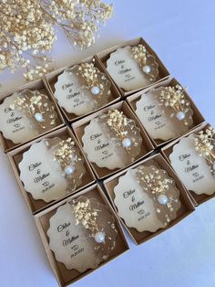 six wedding favors in a box with pearls and flowers on the top one is for each guest