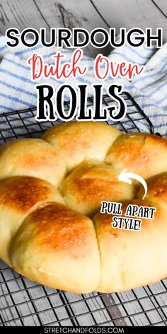 sourdough dutch oven rolls on a cooling rack with text overlay that says sourdough dutch oven rolls