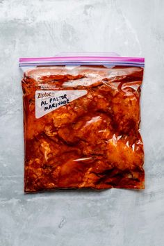 a bag filled with meat sitting on top of a table