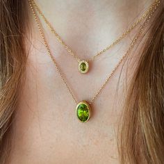 Petite Peridot Pendant surrounded by a halo of Yellow Sapphires set in our 14k Yellow Gold Signature CA Bezel on a 16" Cable Chain. August babies, this one is for you. The perfect little Peridot. 14k Yellow Gold Peridot Center Yellow Sapphires approx. 0.10 cts Pendant approx. 10mm x 8mm Style Note: Length is 16". Peridot Pendant Necklace, Peridot Necklace Gold, Yellow Sapphire Jewelry, Ethereal Jewelry, Faberge Jewelry, Fancy Jewelry Necklace, Pretty Jewelry Necklaces, Peridot Jewelry, Peridot Pendant