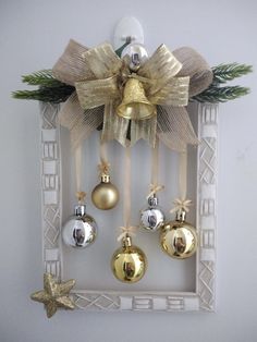 an ornament hanging on the wall with bells