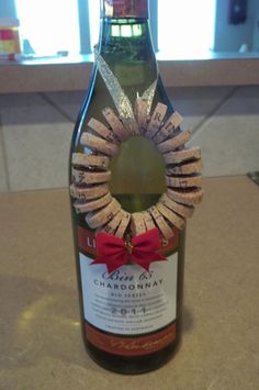 a bottle of wine with a cork wreath on it