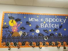 a bulletin board that says, we're a spooky batch on it