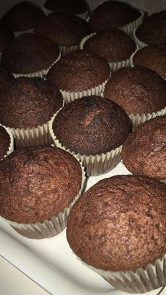 chocolate muffins on a white tray ready to be baked in the oven for consumption