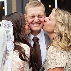 two women and a man kissing each other