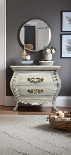 a white dresser sitting in front of a mirror