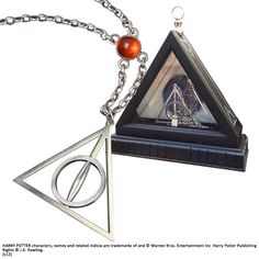 harry potter's deathly hall pendant with an orange bead