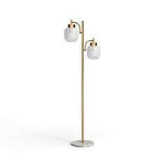 a floor lamp with two white glass shades on the top and one gold metal pole