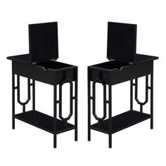 a pair of black chairs sitting next to each other