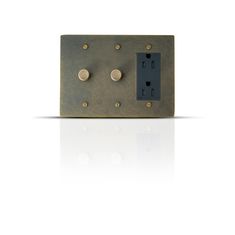 a metal switch plate with two screws on it's side and an electrical outlet in the middle