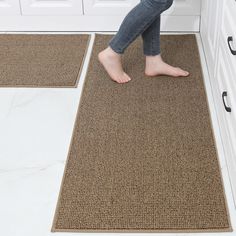 a person standing on the floor in front of a door with their feet propped up