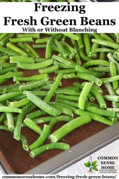 fresh green beans on a cutting board with text overlay that reads freezing fresh green beans with or without blanching