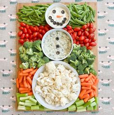 a platter filled with vegetables and dip