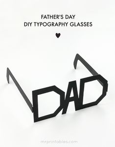 the word dad is cut out from black paper