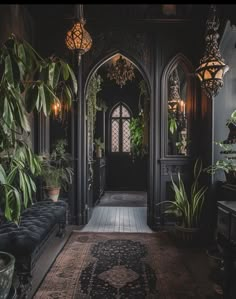 an ornate entry way with potted plants on either side