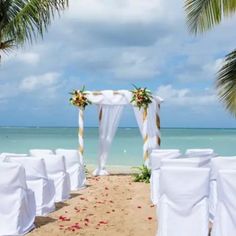 an outdoor wedding set up on the beach