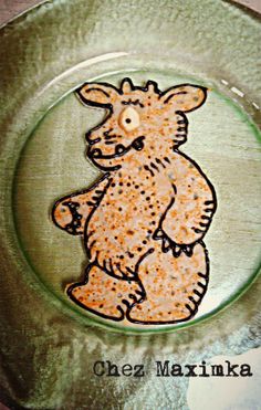 a glass plate with a drawing of a bear on it