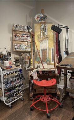 an artist's studio with lots of art supplies