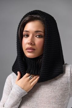 Black Hooded scarf, Turtleneck Hoodie, Knit Balaclava, Hooded Cowl, Knitted Hood Scarf, Womens Woolen Hood, Wool Scarf, Gift for Her The multifunctional winter accessory is made of semi-woolen yarn. The model consists of an elastic collar that covers the neck well and a spacious hood in a textured weave. The elegant accessory has a wide lapel for extra warmth. Leave this snood on after you take off your jacket, it will become a stylish addition to a pullover or sweater. A super soft and cozy hooded scarf. Product details: 70% acrylic, 20 % mohair, 10 %wool Width - 14 in Length - 20 in Black Knitted Winter Bonnet, Winter Knitted Black Bonnet, Winter Black Knitted Bonnet, Black Knitted Winter Hoodie, Black Knitted Hoodie For Winter, Knitted Hoodie For Cold Weather, Cozy Black Knitting Pattern For Winter, Cozy Black Winter Knitting Pattern, Winter Hooded Balaclava One Size