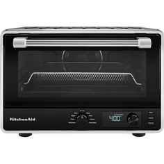 a toaster oven with the door open and an electronic timer on it's side