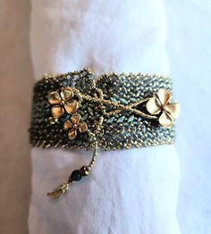 a close up of a bracelet on a napkin